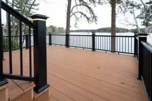 Composite deck with black railing and lighting in NH