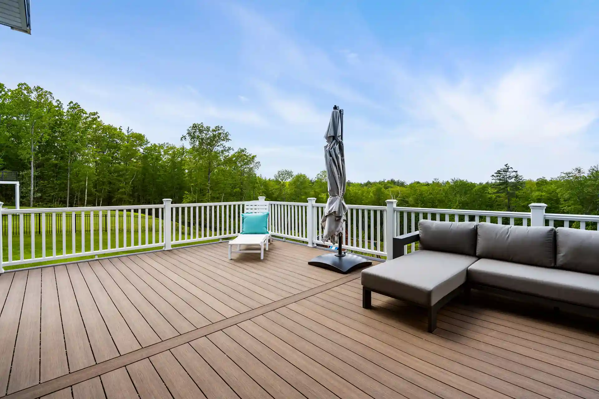 Photo of a Deckorators composite deck with outdoor furniture.