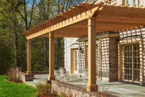 Wooden pergola in a backyard patio Pergola Builders in New Hampshire