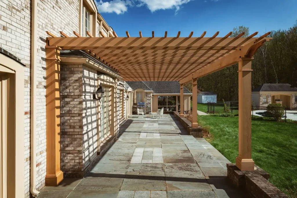 Wooden pergola in a backyard patio Pergola Builders in New Hampshire