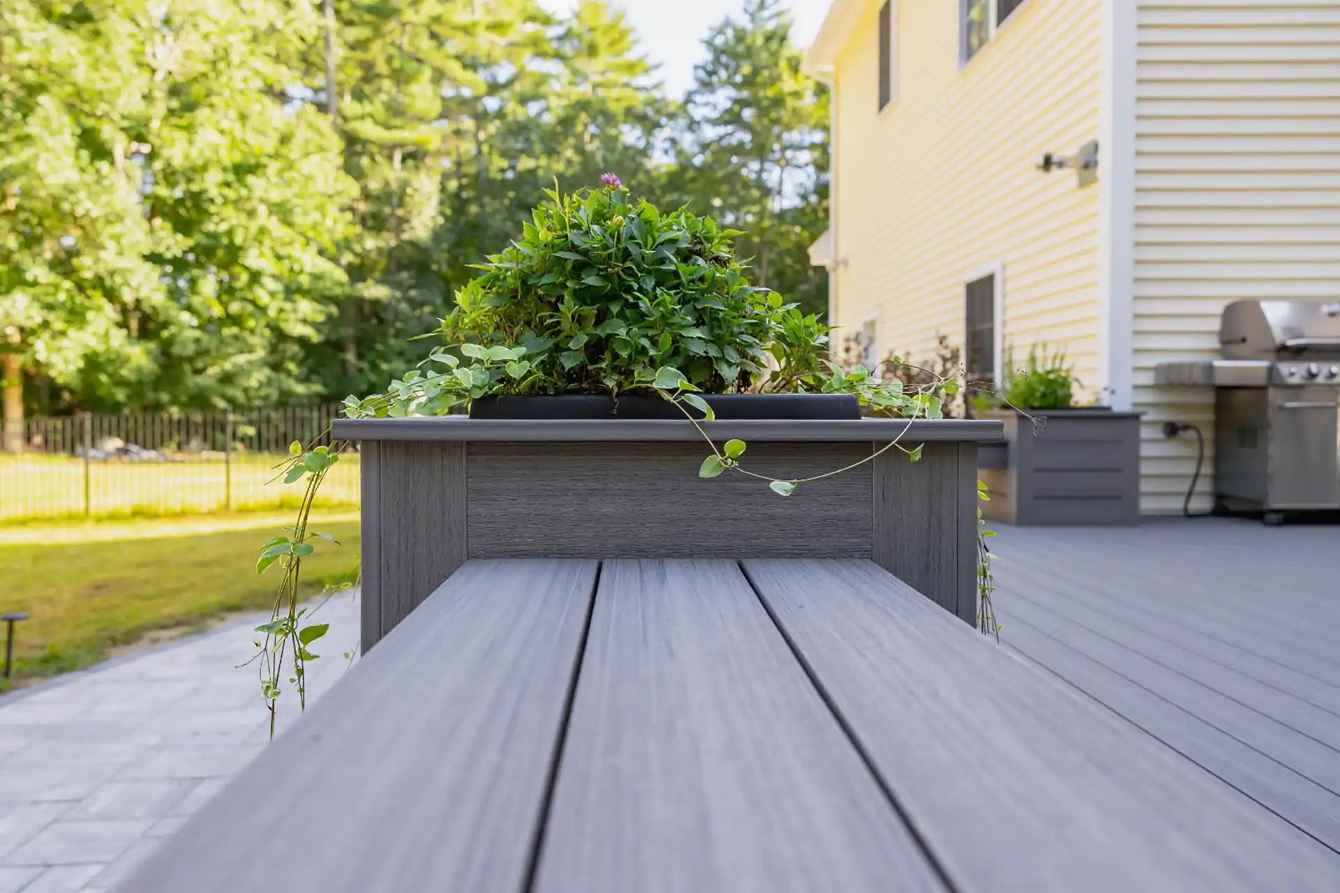 photo of a built-in seating and custom planter boxes that make good additions to porches - Custom porch builders in New Hampshire