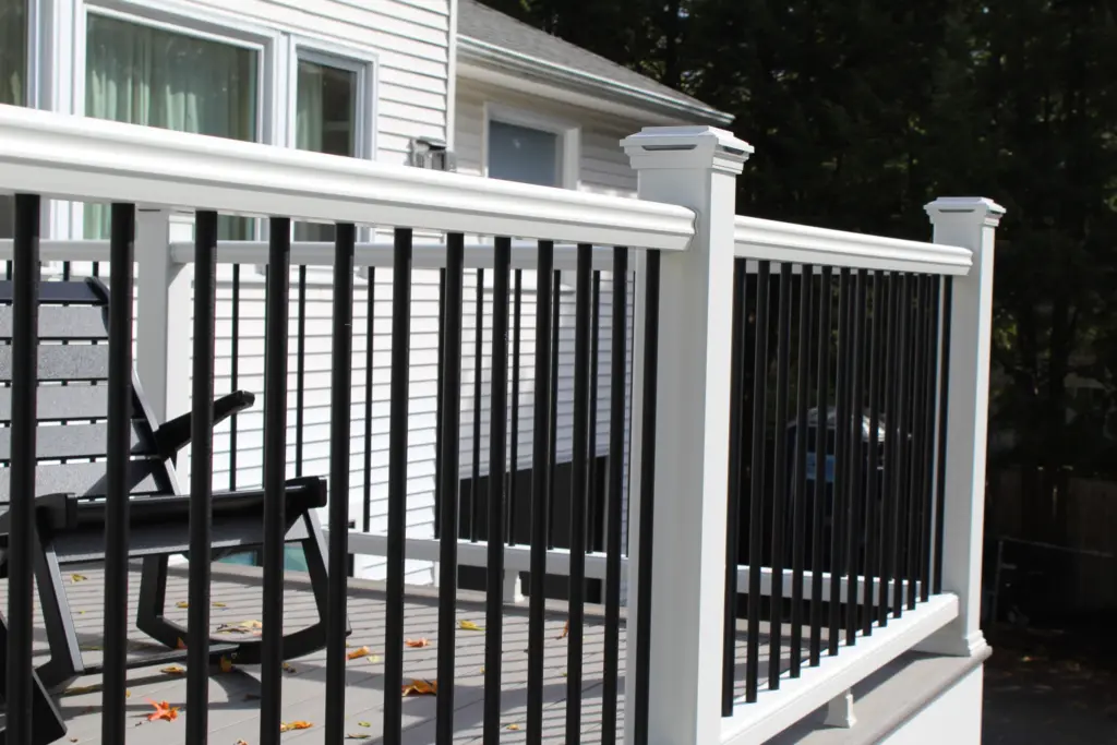 deck-railing-with-black-balusters-and-a-swing-chair-in-merrimack-nh